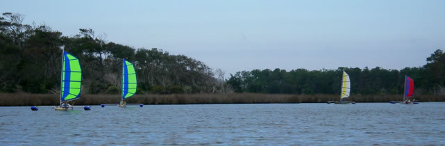 group of sailing kayaks with BSD Batwing Expedition sail rigs and Boss outriggers