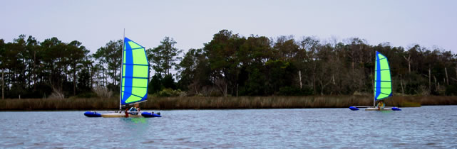 group of sailing kayaks with BSD Batwing  sail rigs and Boss outriggers