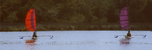 group of sailing kayaks with BSD Batwing Expedition and Sport sail rigs and Boss outriggers